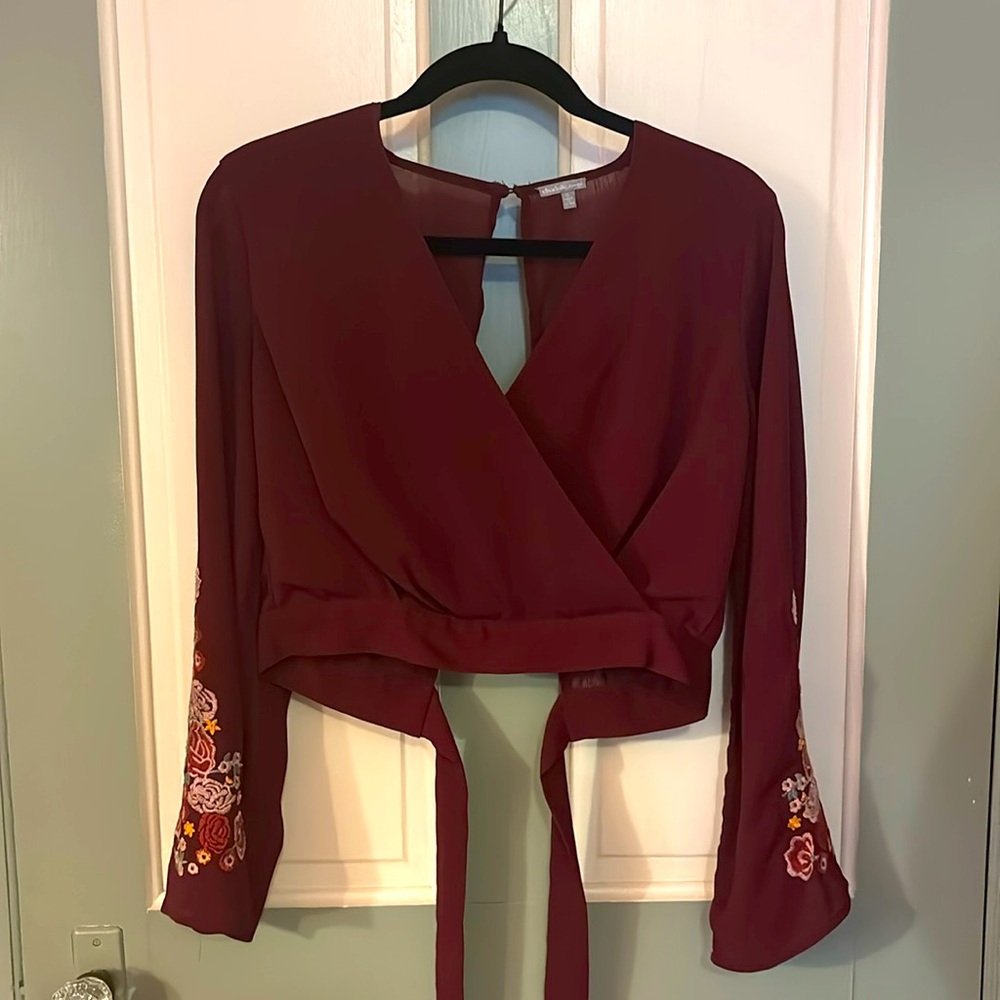 burgundy wrap blouse with floral sleeve embroidery